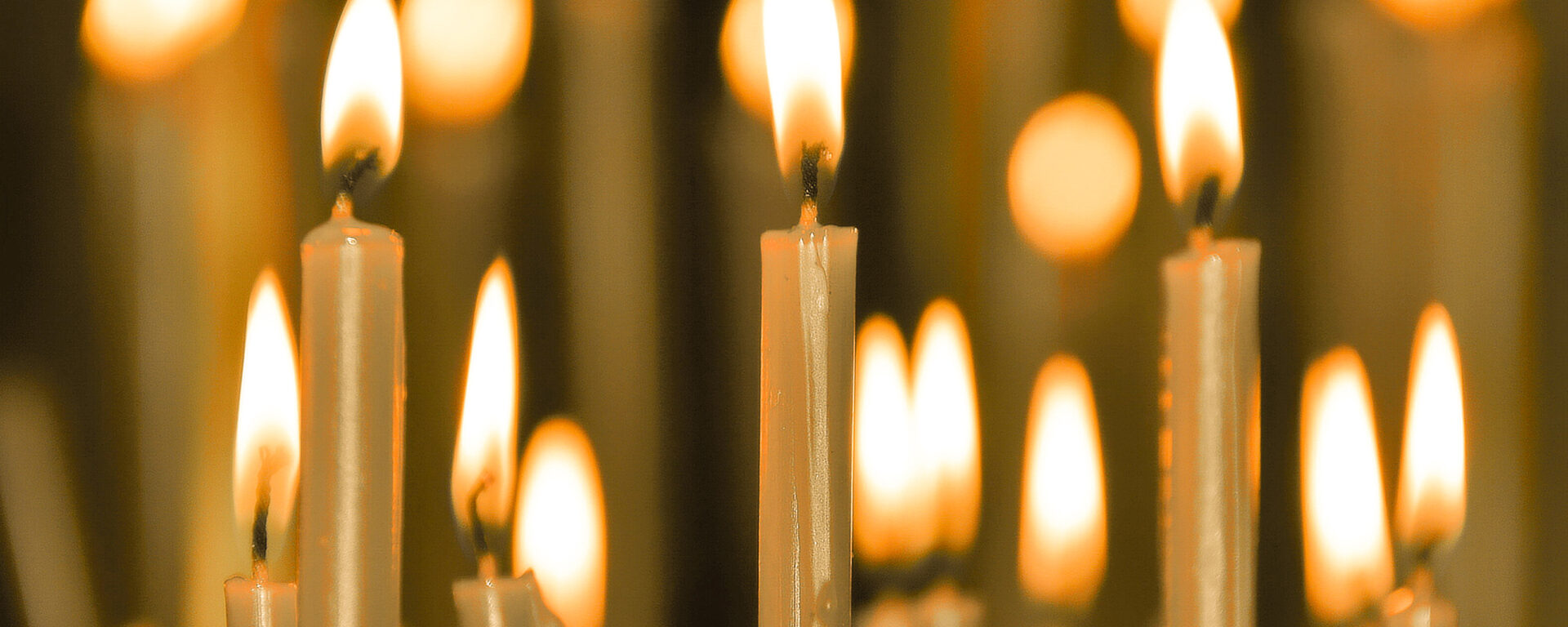 Burning candles during worship.